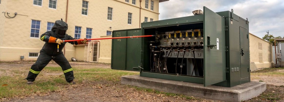 A CPS Energy technician shuts down power to an office building for the exercise at Joint Base San Antonio-Fort Sam Houston on March 26, 2026. The power outage exercise was to help JBSA installations prepare for real-word scenarios. (U.S. Air Force photo by Melissa Hydrick)
